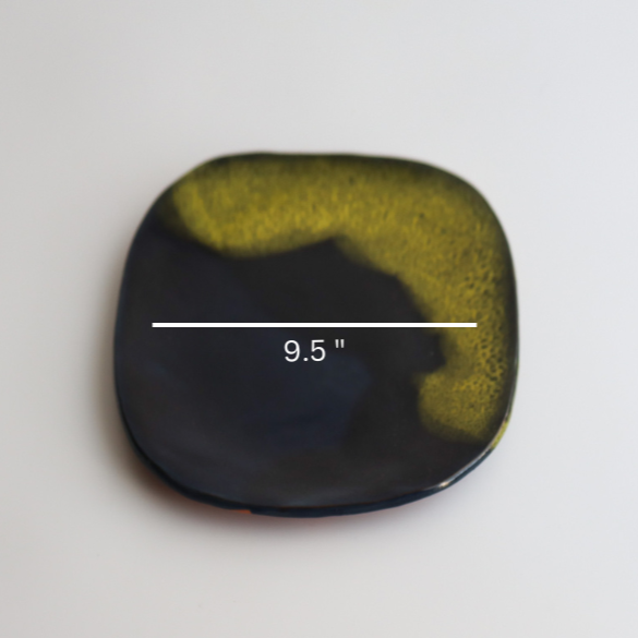 one handmade ceramic plate with blue and yellow glaze showing a nine and a half inch diameter