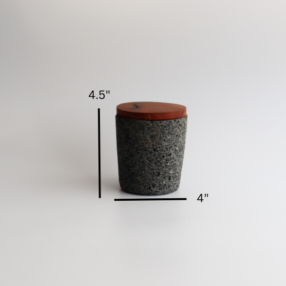 Studio CM | medium volcanic stone pestle with a wooden top and wooden top on a white background