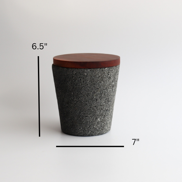 Studio CM | extra large volcanic stone mortar with a wooden top including a wooden pestle with a white background