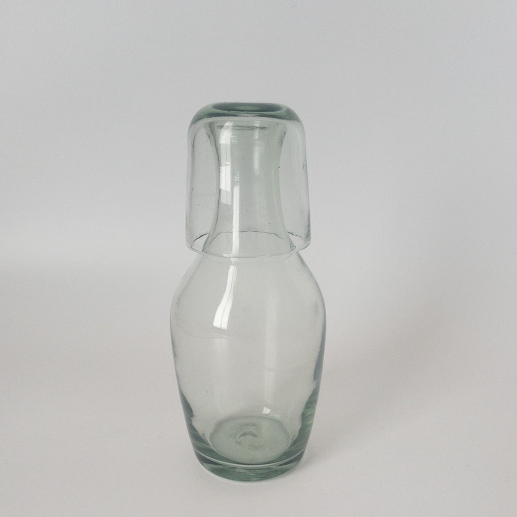 Studio CM | a handblown clear carafe with it's cup as a top made in Jalisco from recycled glass