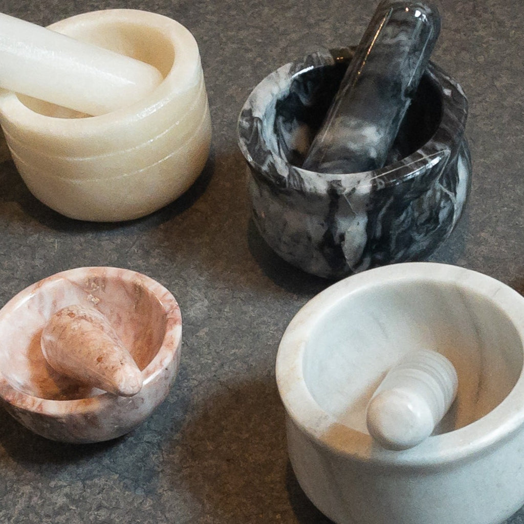 Studio CM | four onyx and marble mortars in different sizes and colors hand cut in Jalisco Mexico