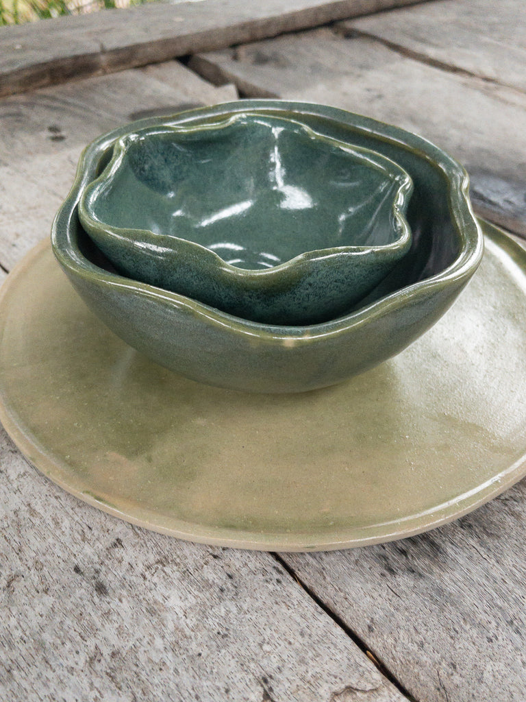 Studio CM | A green plate with two ceramic wavy bowls that fit inside each other handmade in Oaxaca