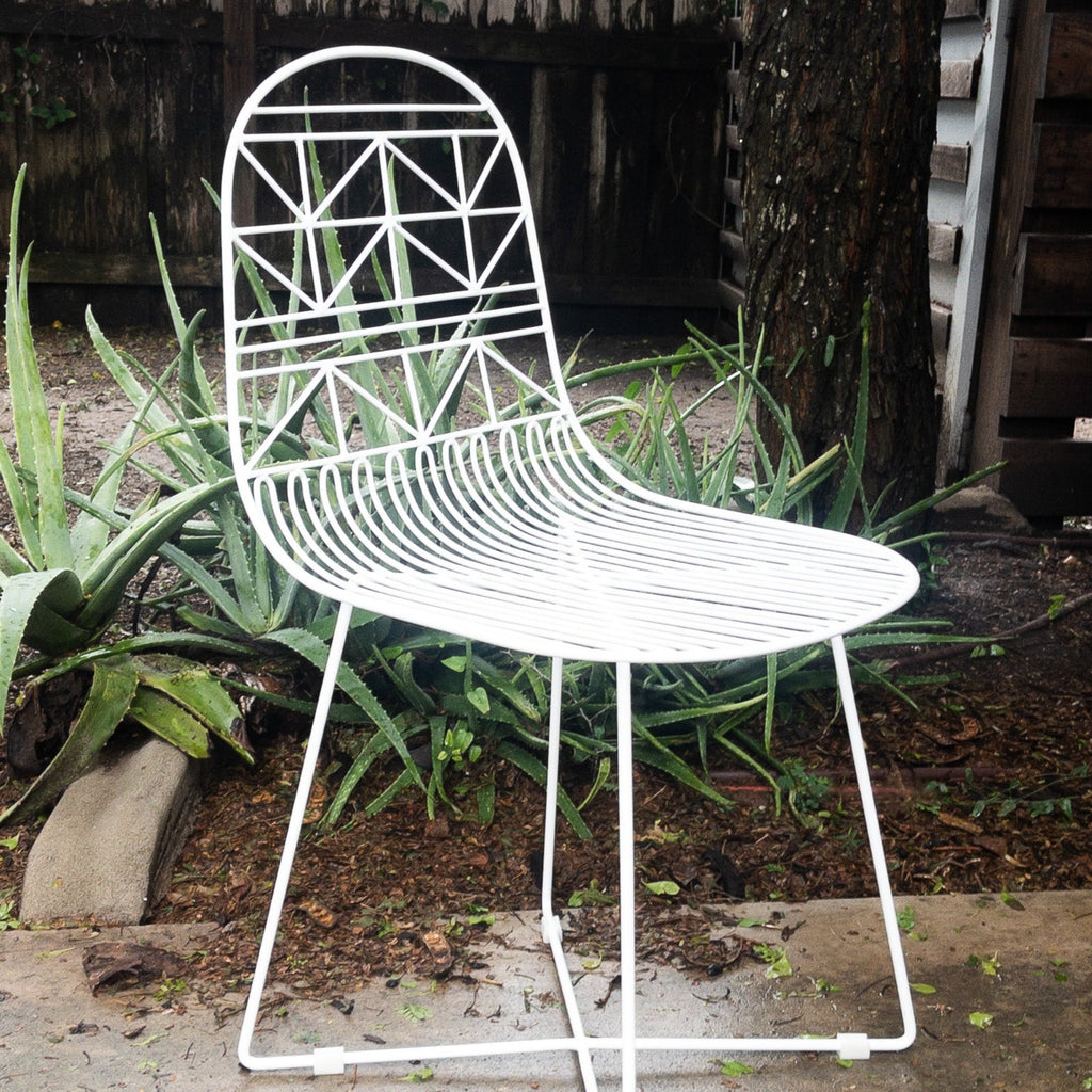 Studio CM | modern white rod iron chair with a light and delicate pattern