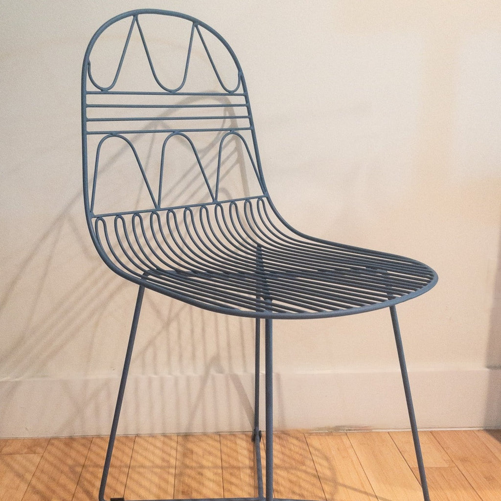 Studio CM | modern blue rod iron chair with a light and delicate pattern