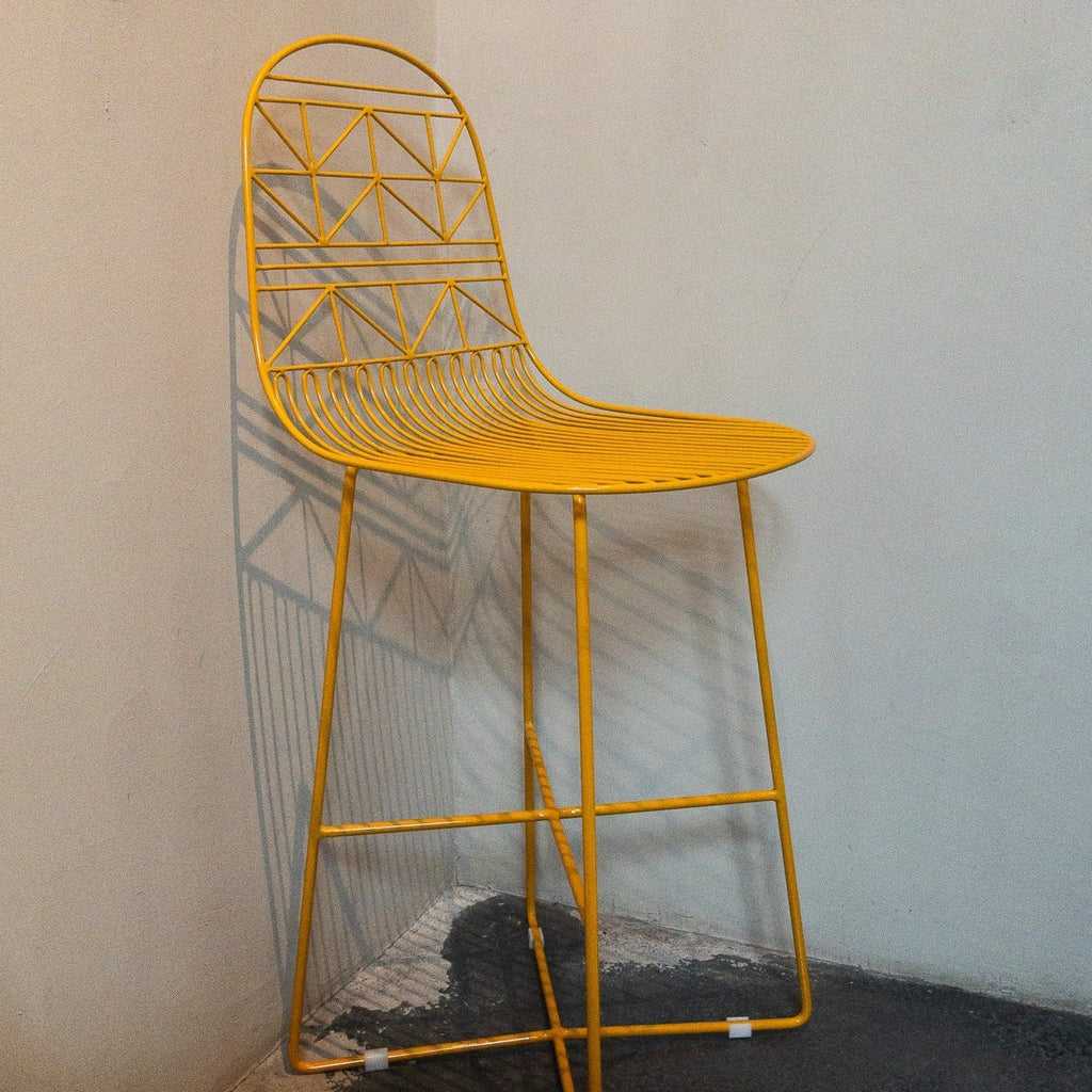 Studio CM | modern yellow rod iron stool with a light and delicate pattern