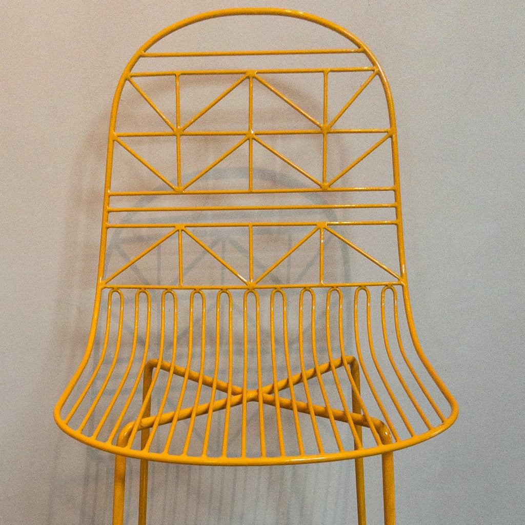 Studio CM | modern yellow rod iron stool with a light and delicate pattern