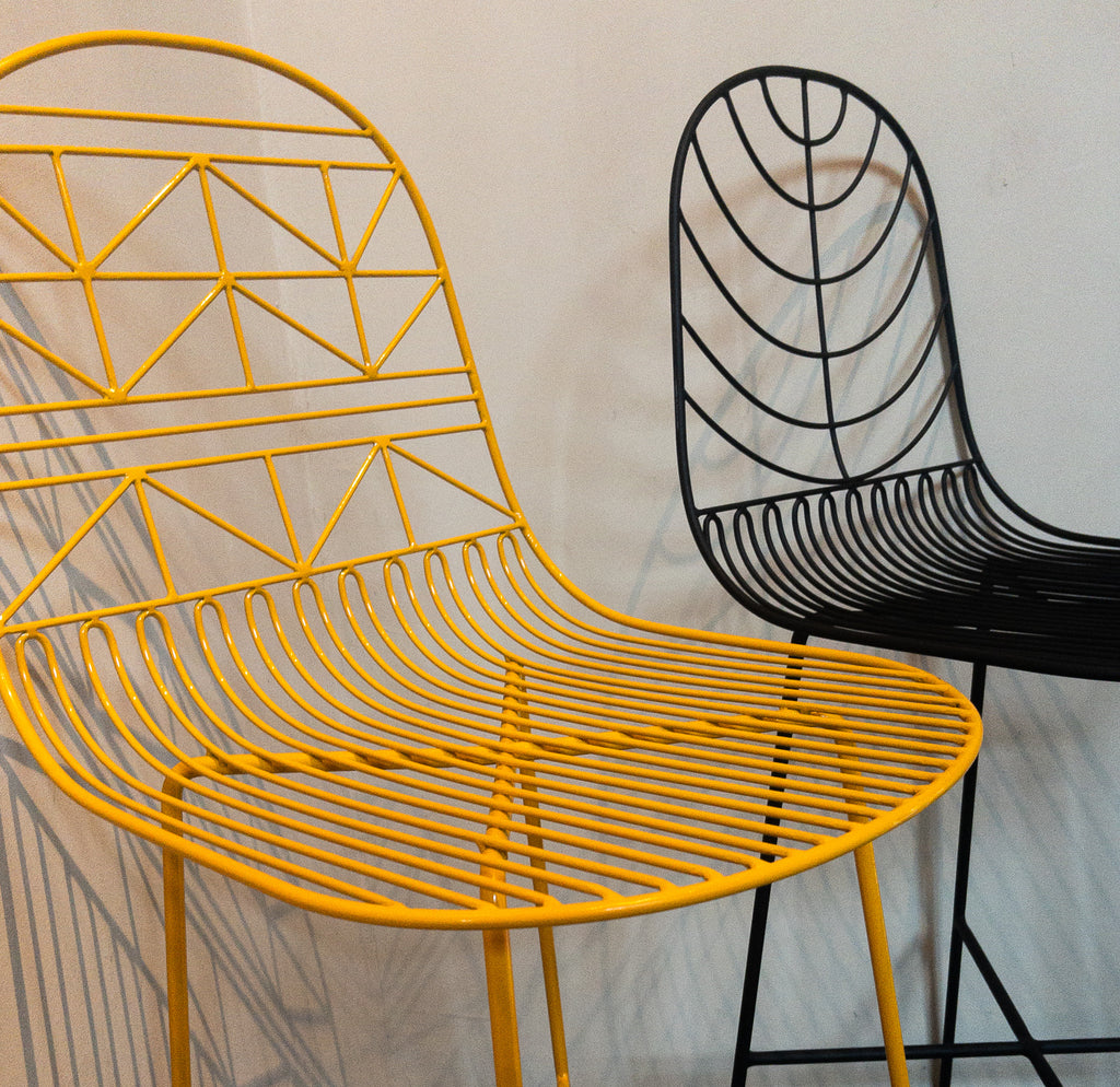 Studio CM | modern black and yellow rod iron stools  with a light and delicate pattern