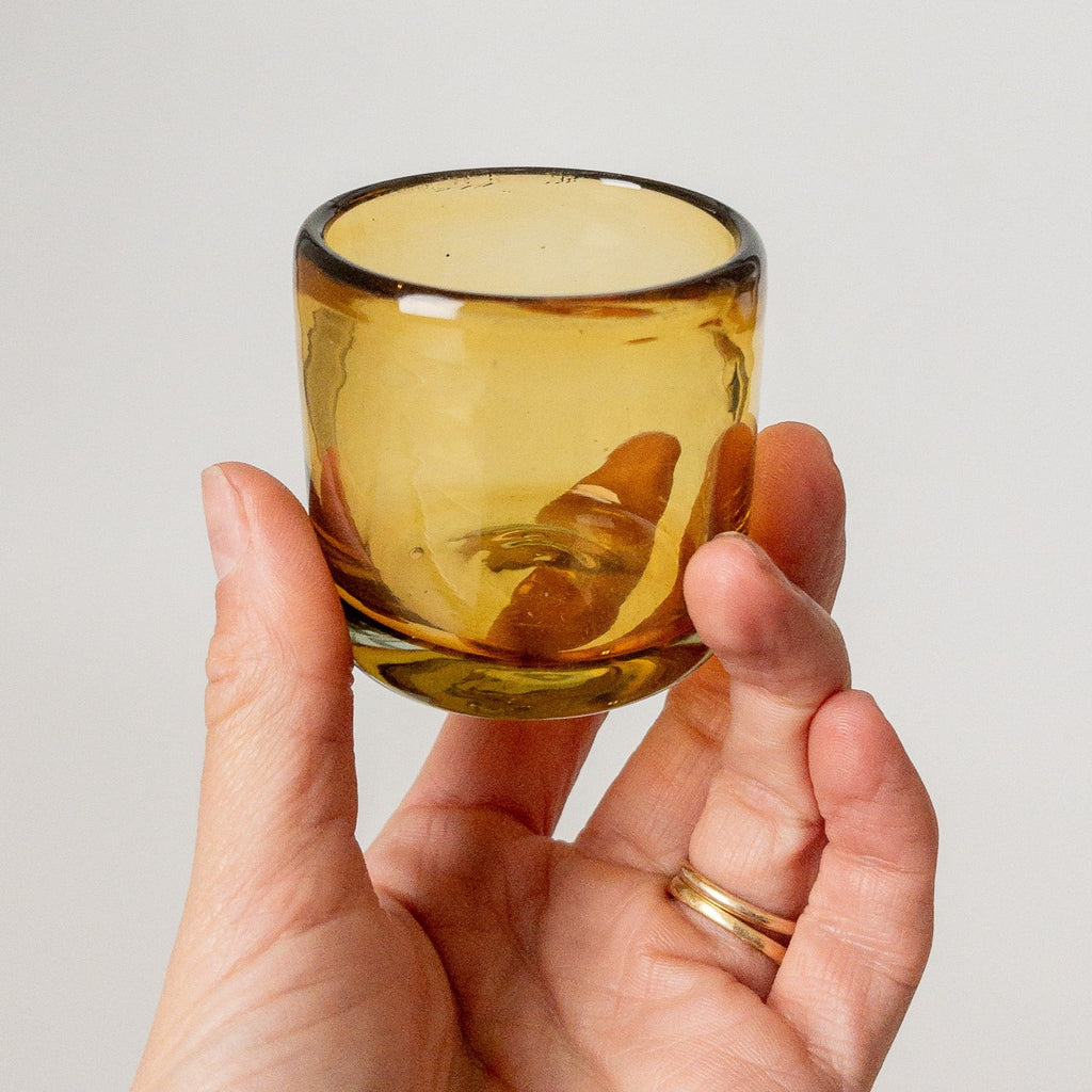 Studio CM | an amber shot glass made from recycled glass in Jalisco Mexico