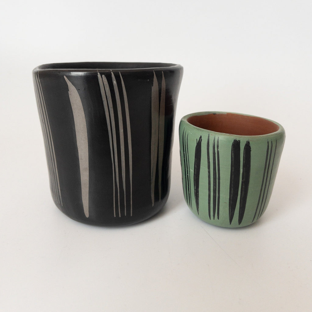 Studio CM | two cups that are handpainted and made in Michoacan mexico in various colors and sizes 