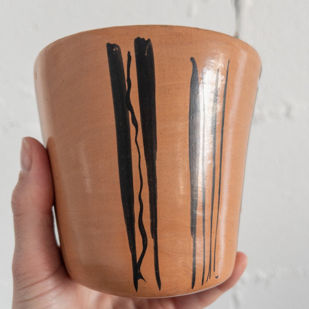 Studio CM | A tan ceramic cup that has hand painted designs in gray ink made in Michoacan, Mexico