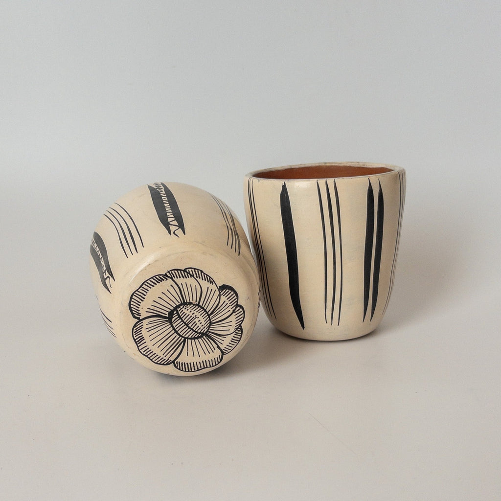 Studio CM | A white ceramic cup that has hand painted designs in black ink made in Michoacan, Mexico