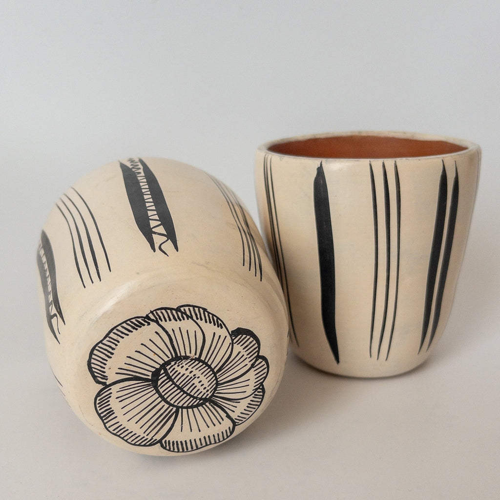 Studio CM | A white ceramic cup that has hand painted designs in black ink made in Michoacan, Mexico