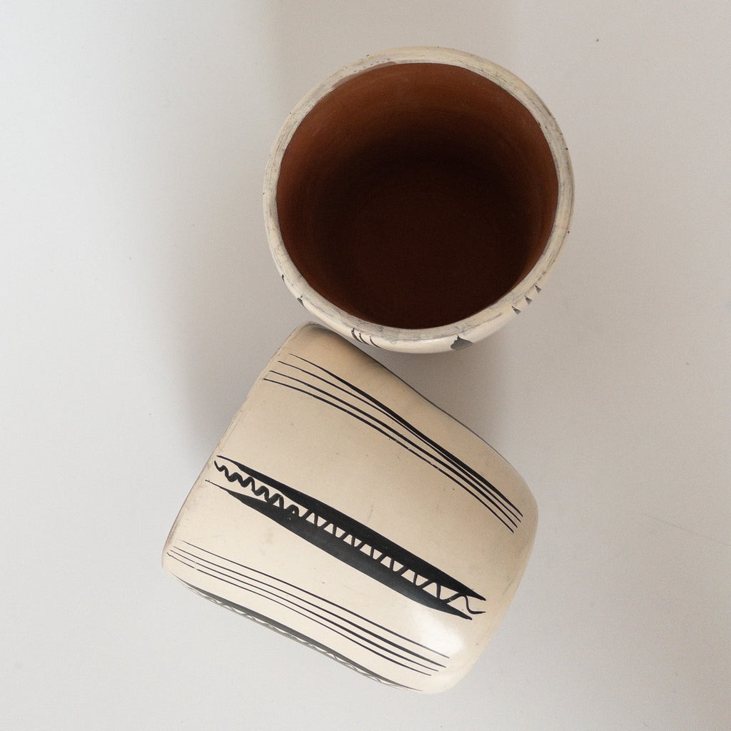 Studio CM | A white ceramic cup that has hand painted designs in black ink made in Michoacan, Mexico