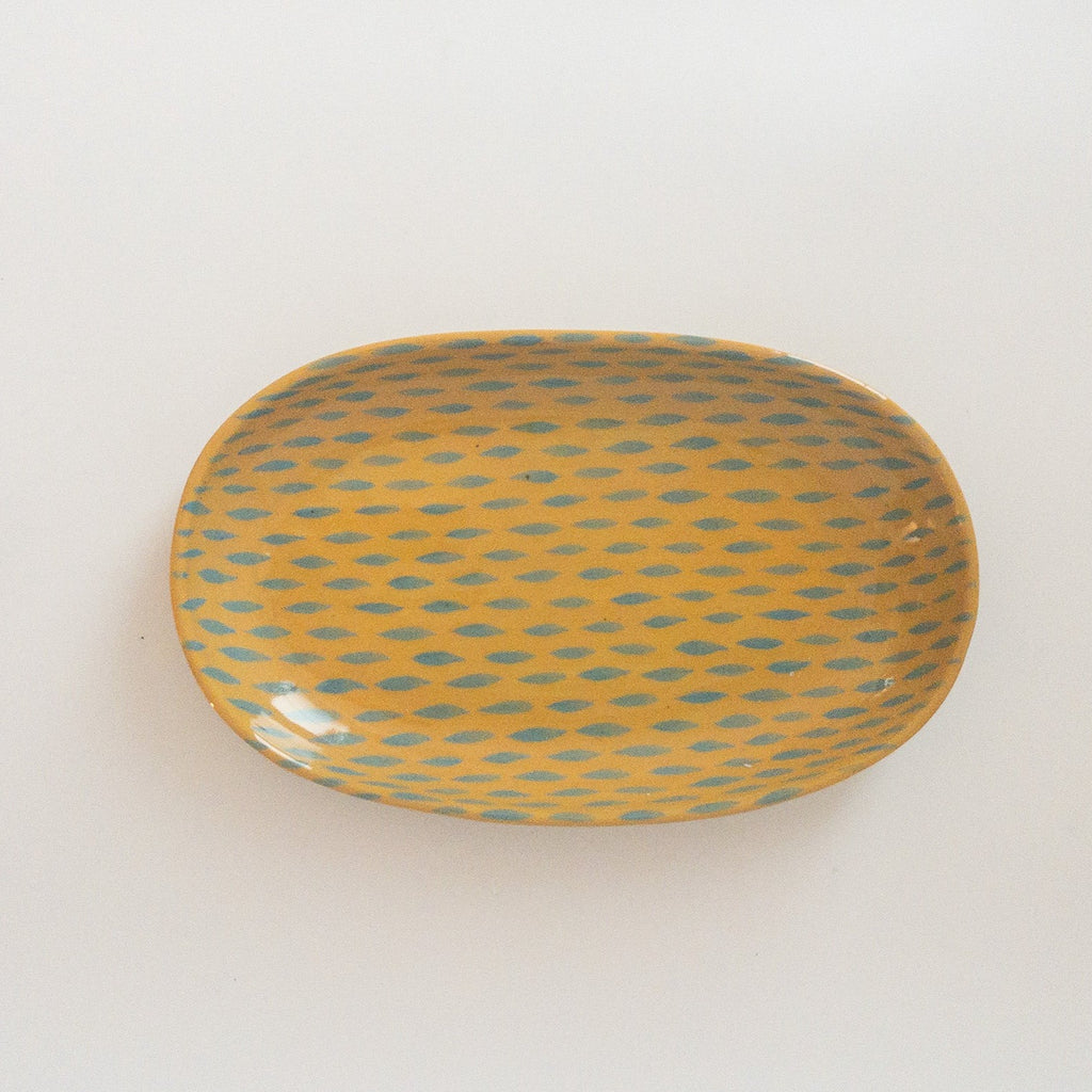 Studio CM | A yellow ceramic tray adorned with light blue dashes hand painted and made in Michoacan, Mexico