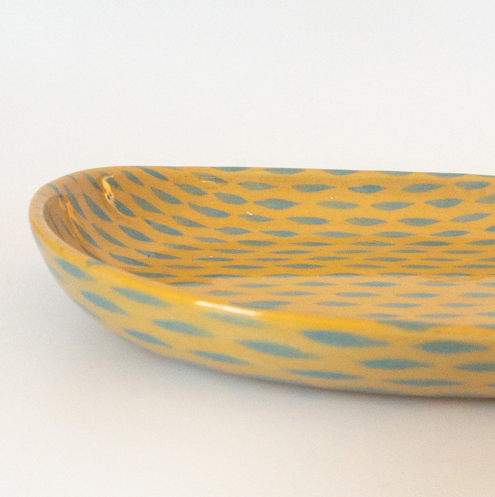 Studio CM | A yellow ceramic tray adorned with light blue dashes hand painted and made in Michoacan, Mexico