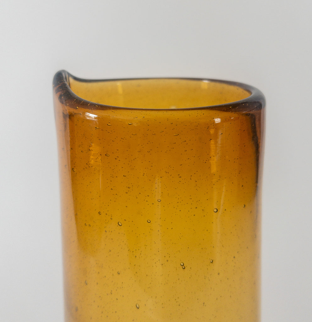 Studio CM | A handblown amber cylindrical pitcher made from recycled glass in Jalisco, Mexico