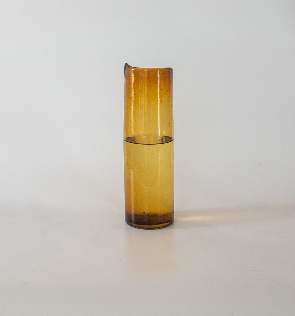 Studio CM | A handblown amber cylindrical pitcher made from recycled glass in Jalisco, Mexico