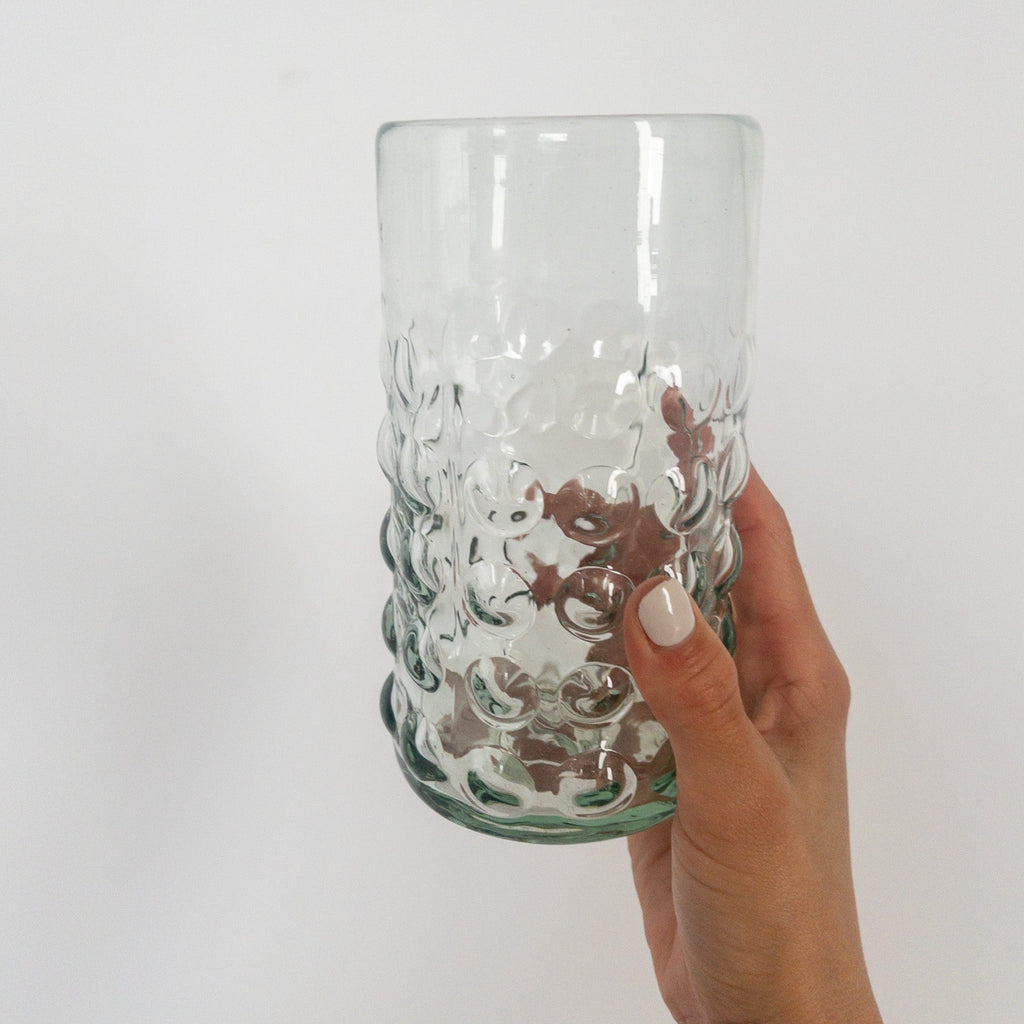 Studio CM | large pint sized glasses that are handblown and have large clear dots as decoration on the exterior