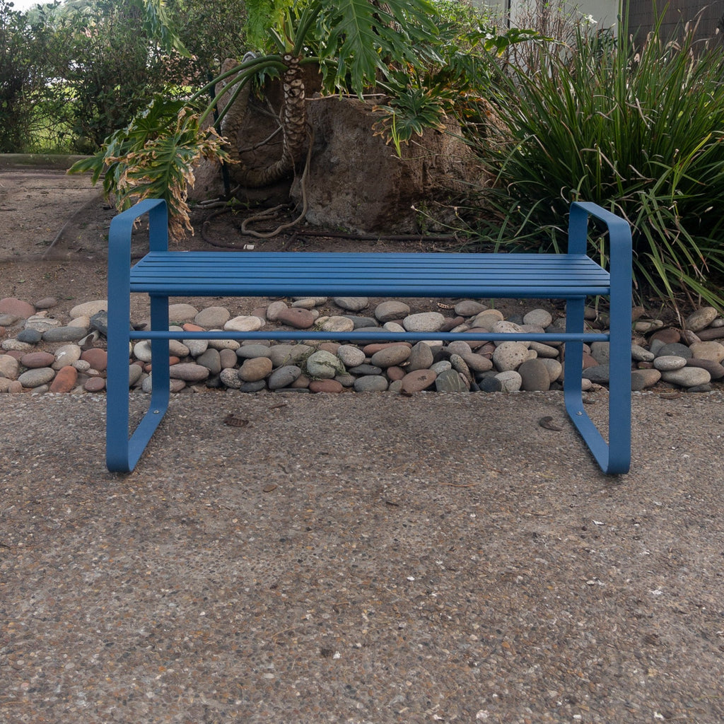 Studio CM | A contemporary blue metal bench made of steel in an outside space. The bench is hand made in Guadalajara, Mexico. 