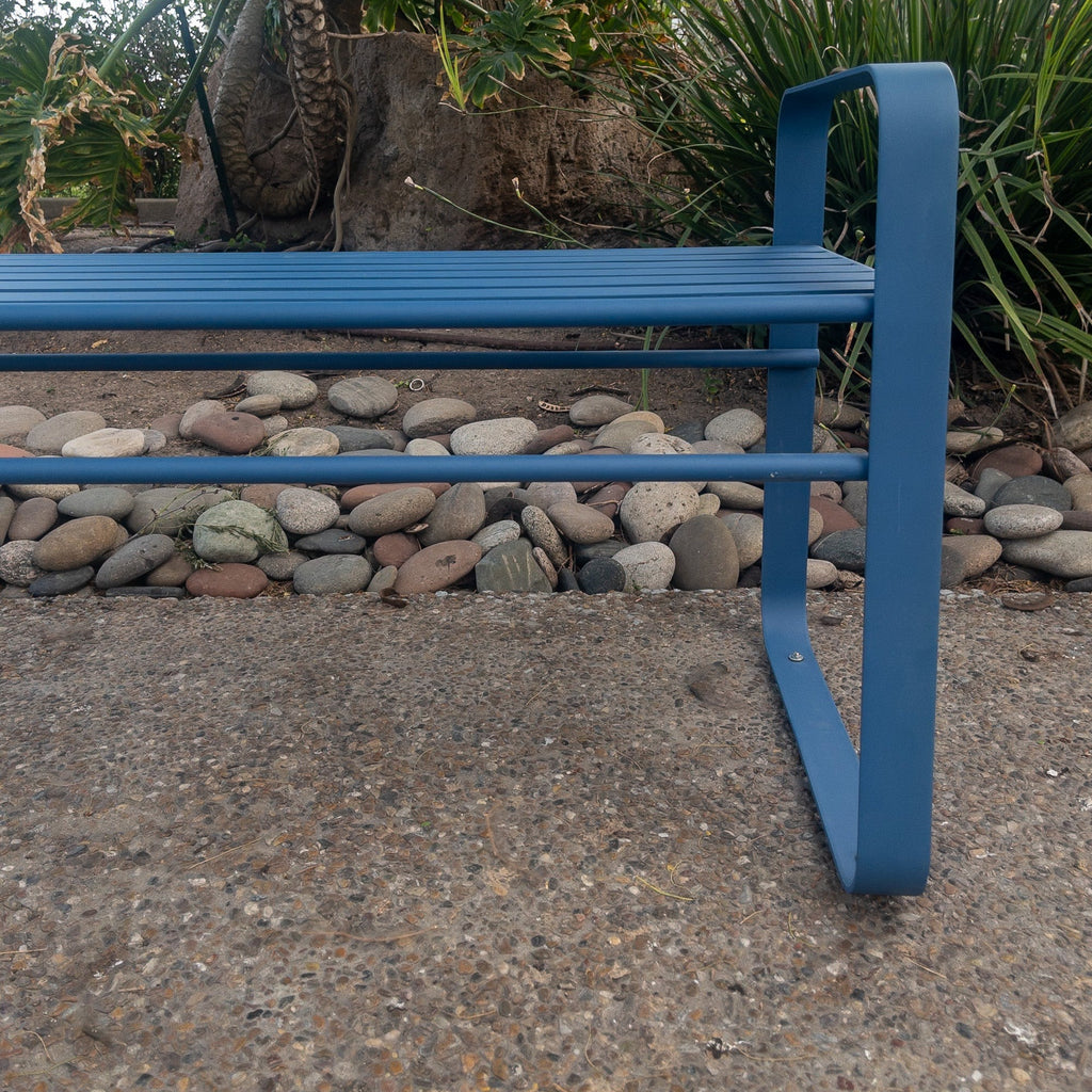 Studio CM | A contemporary blue metal bench made of steel in an outside space. The bench is hand made in Guadalajara, Mexico. 