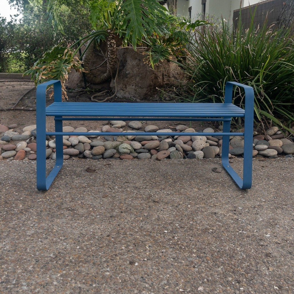 Studio CM | A contemporary blue metal bench made of steel in an outside space. The bench is hand made in Guadalajara, Mexico. 