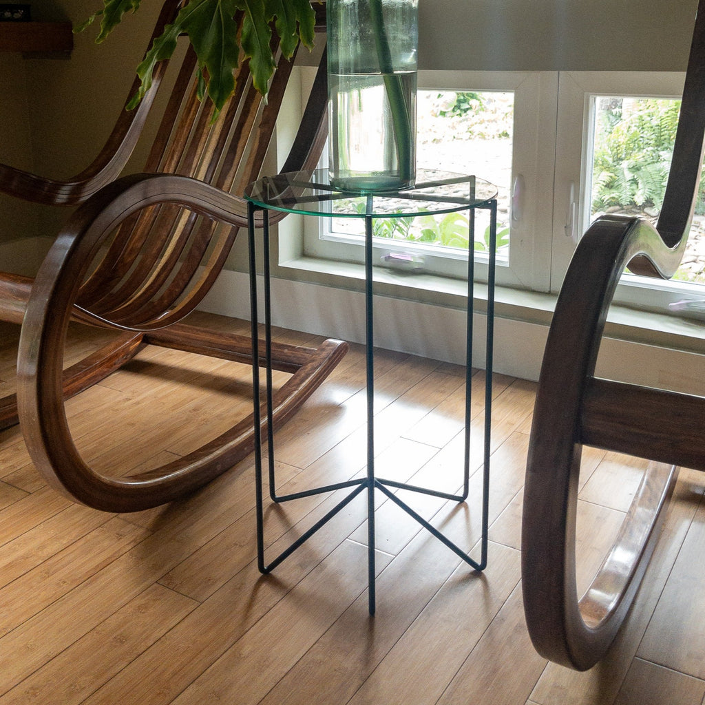 Studio CM | a black side table made of rod iron with a round tapered glass top made in Guadalajara Mexico