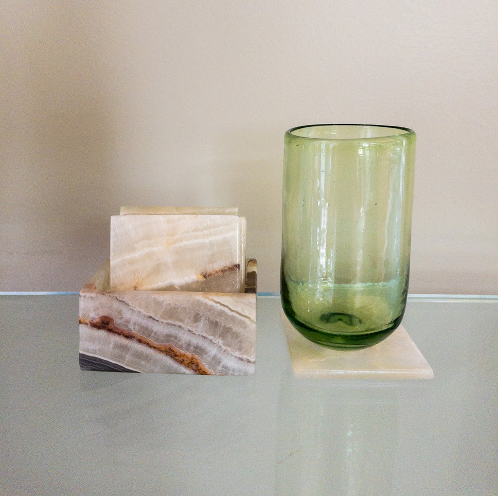 Studio CM | a set of green hand carved marble coasters in a square shape