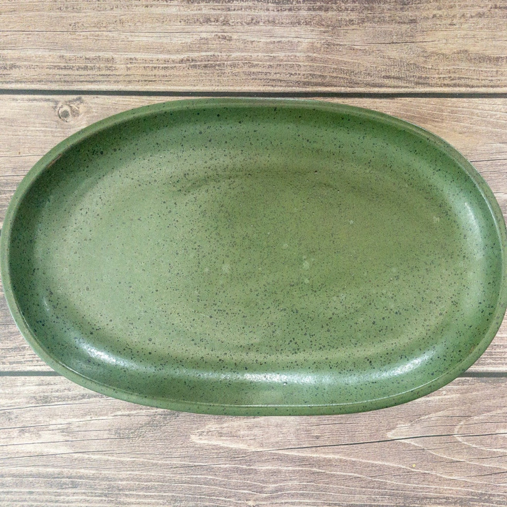 Studio CM | a green ceramic tray with handpainted black speckles adorning it. Made in Michoacan, Mexico.