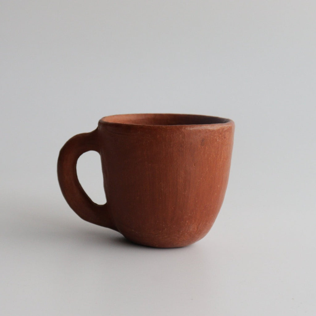 Studio CM | red ceramic mug with  a white background