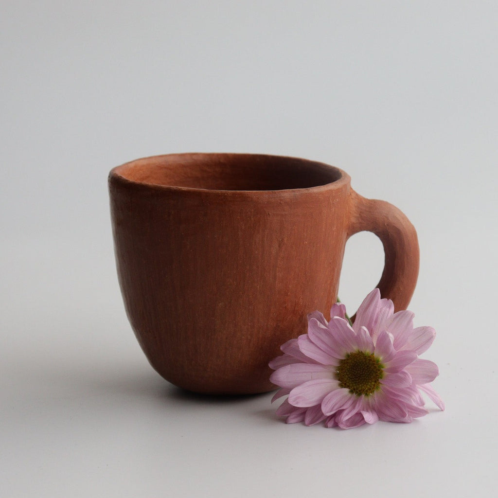 Studio CM | red ceramic mug with a purple flower and a white background