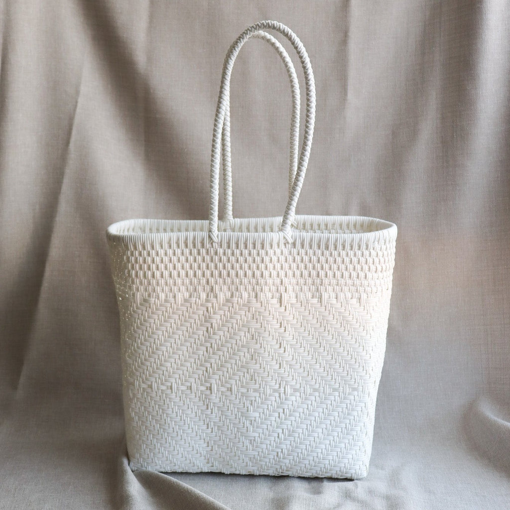 Studio CM | A large handwoven plastic tote that is white made in Jalisco, Mexico