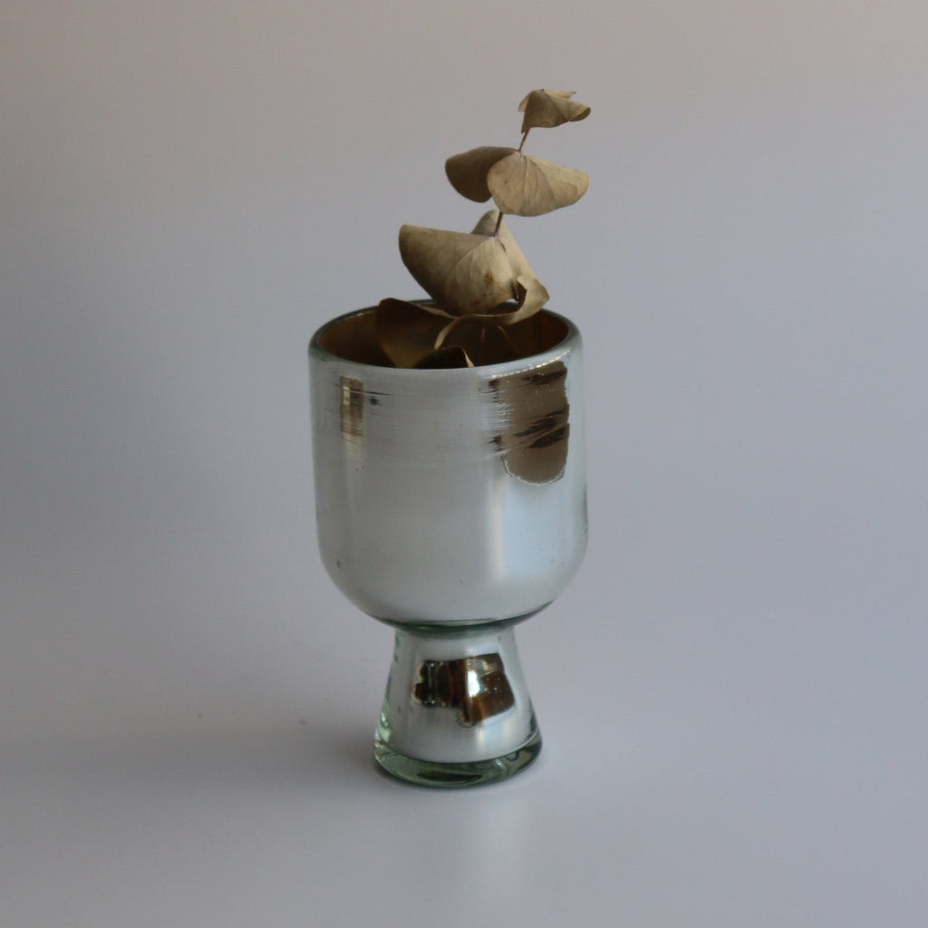 Studio CM | a handblown small silver metallic glass vase with a thick stem and a eucalyptus plant