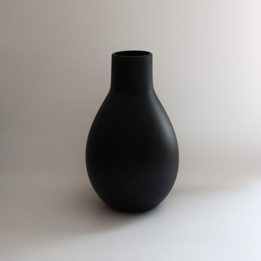 Studio CM | a matte black hand blown vase in a teardrop shape