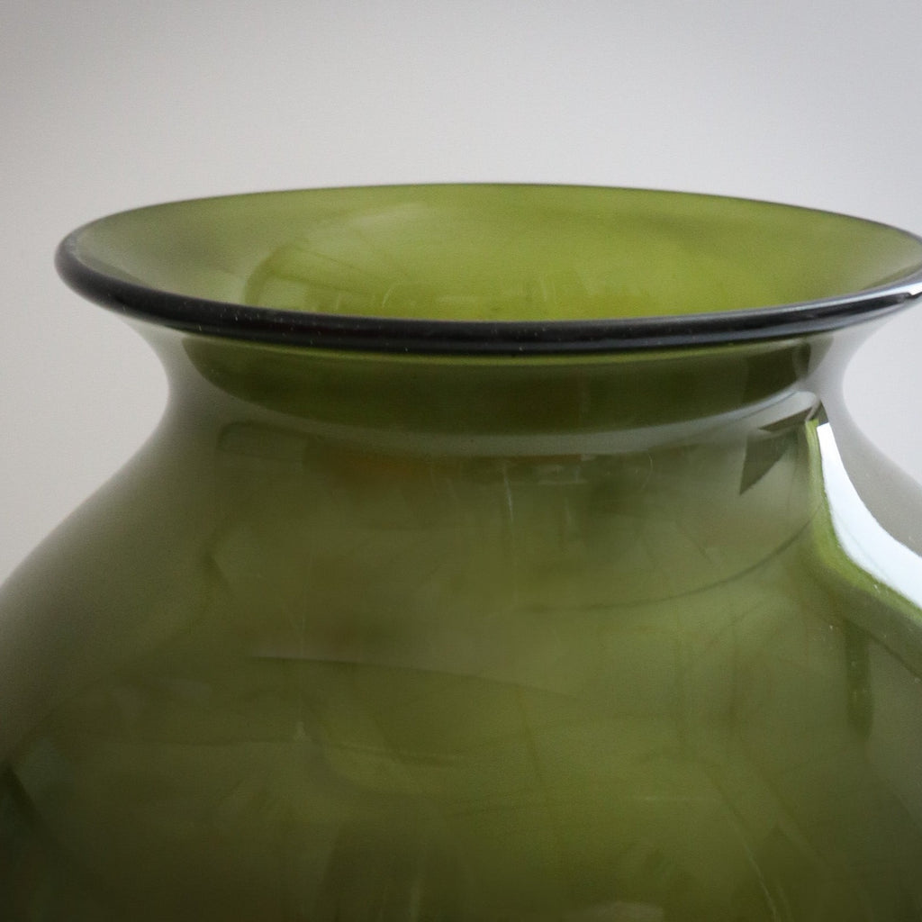 Studio CM | A green handblown vase that is green and round with a wide opening