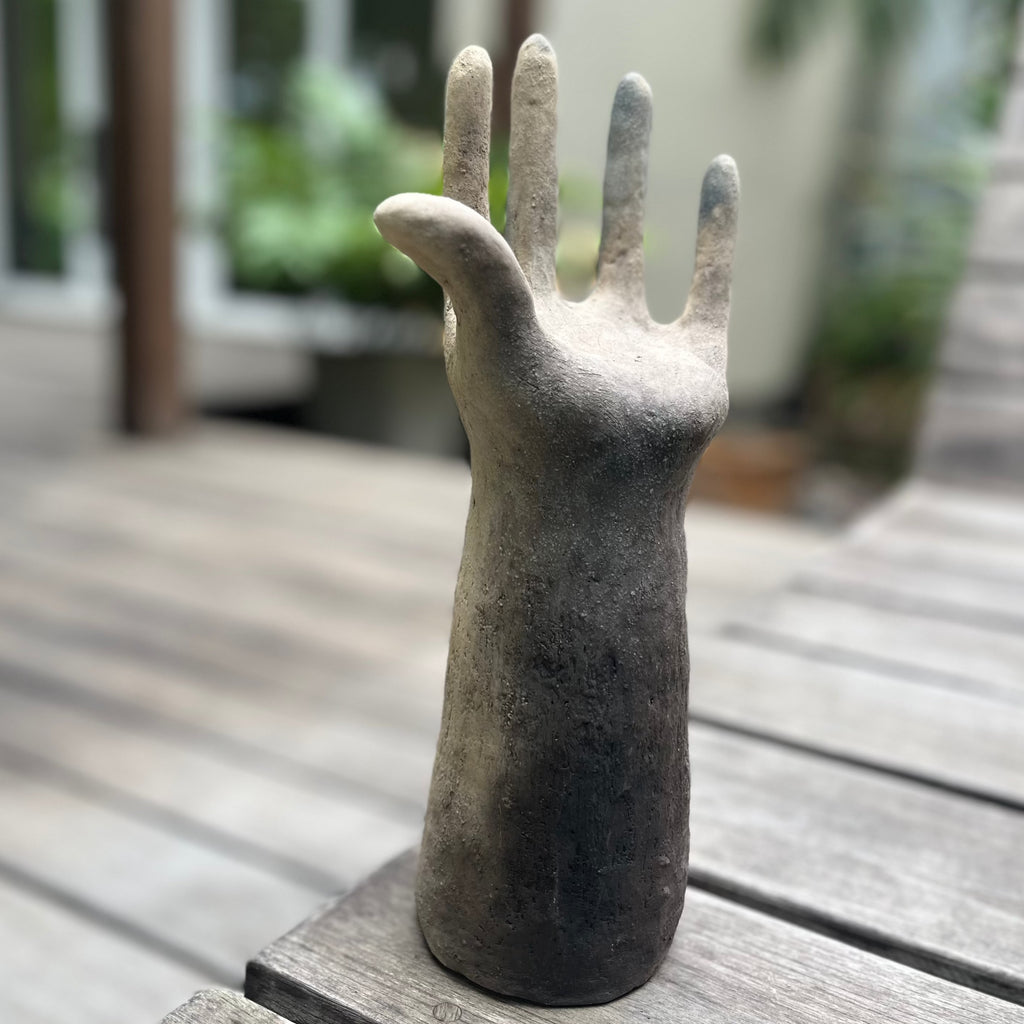 Studio CM | a sculpture hand made from ceramic that is in the shape of a hand