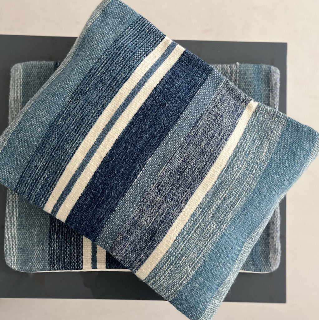 Studio CM | A stripped pillow case made of woven wool with blue and white colors. Handmade in Oaxaca.