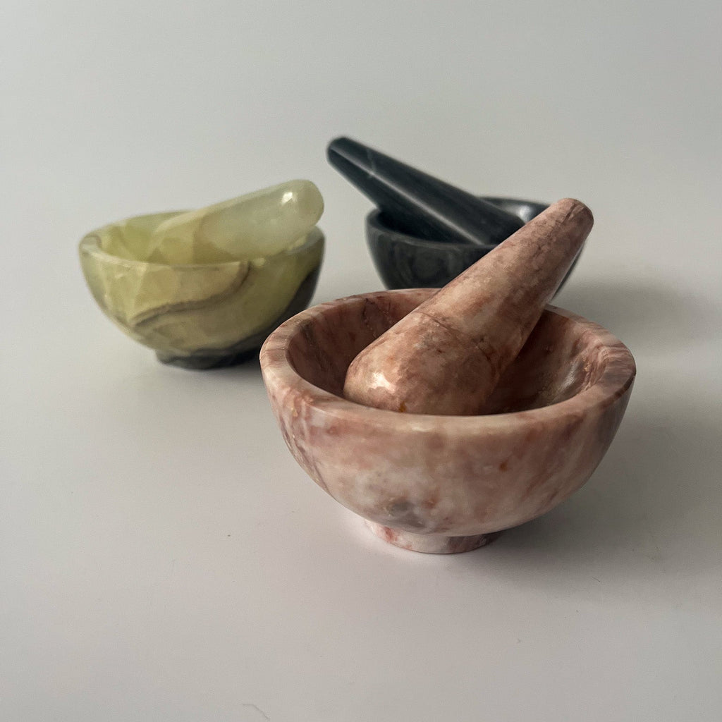 Studio CM | three small stone mortars in pink, green and white made of onyx and marble