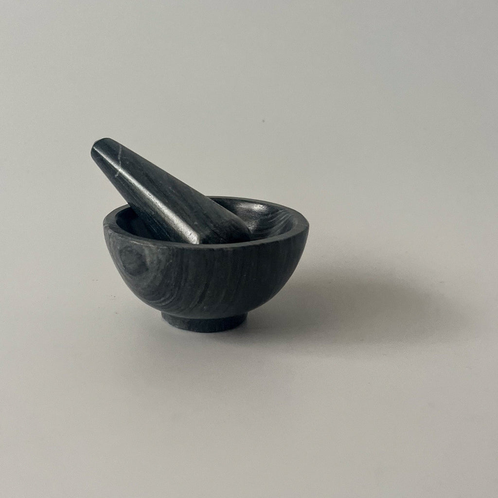 Studio CM | black marble mortar and pestle carved by hand in Jalisco Mexico