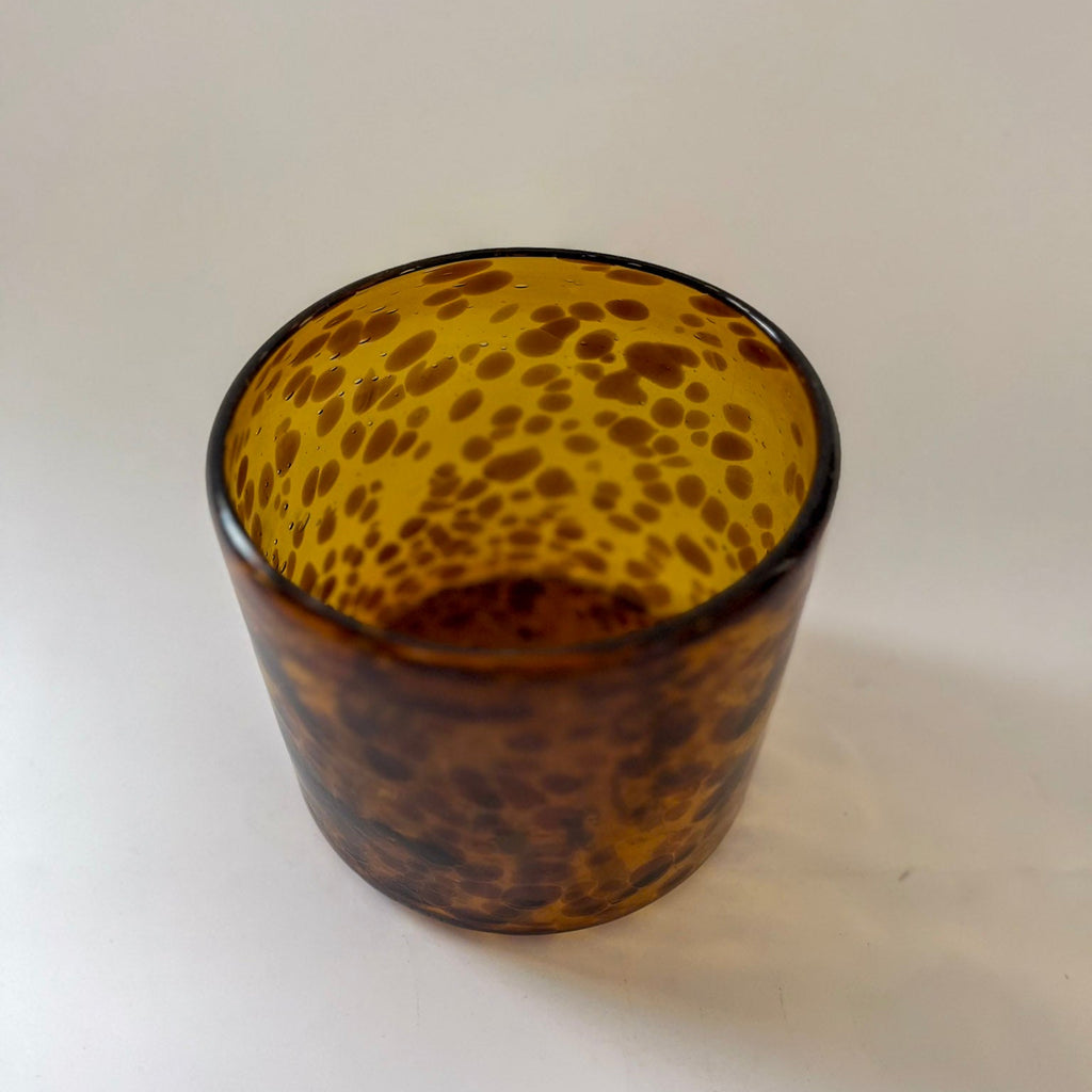 Studio CM | Tortoiseshell-patterned glass on a white background