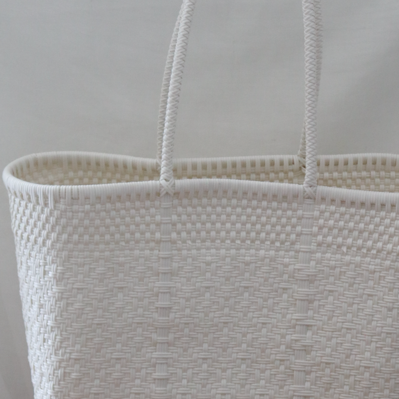 Studio CM | A large handwoven plastic tote that is a white made in Jalisco, Mexico