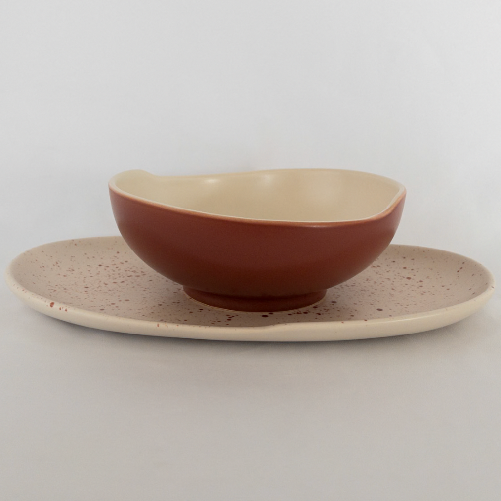 Studio CM | A bowl and long plate set made of ceramic with the same white and terracotta tones