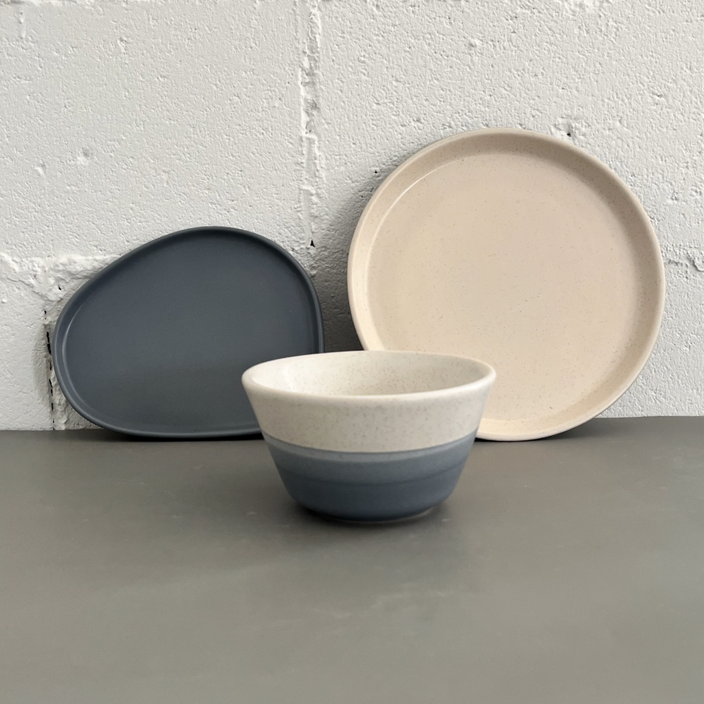 Studio CM | A light blue ceramic plate that has a modern triangle shape part of a set made in CDMX