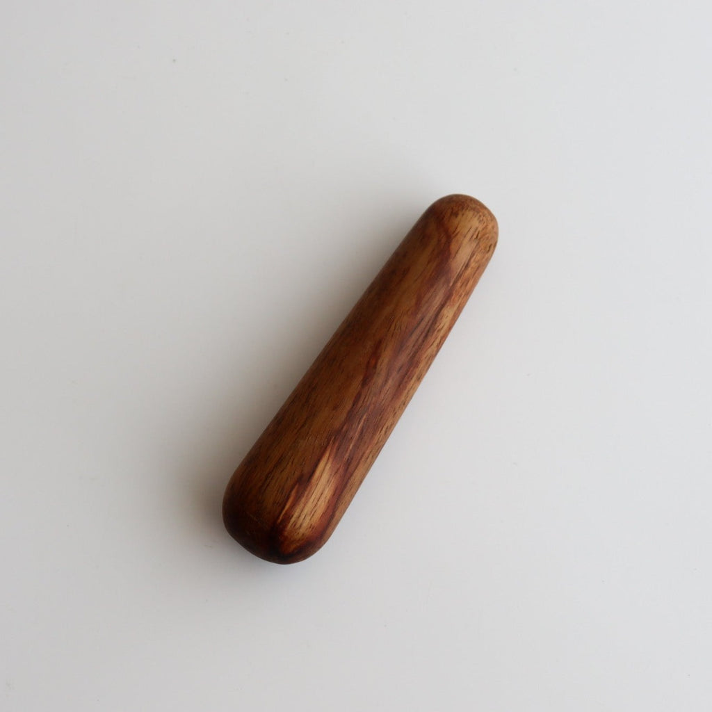 Studio CM | large wooden handcrafted pestle on a white background