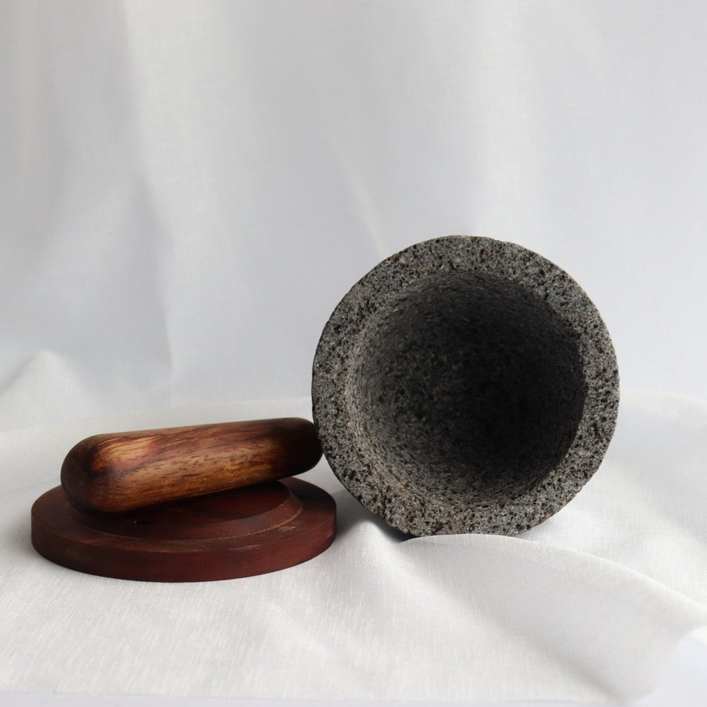 Studio CM | large wooden handcrafted pestle on a white background