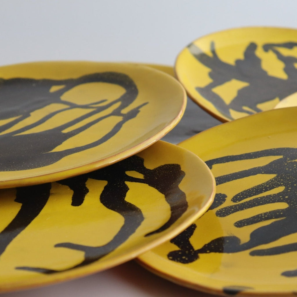 Studio CM | handmade yellow ceramic plates with blue abstract painting