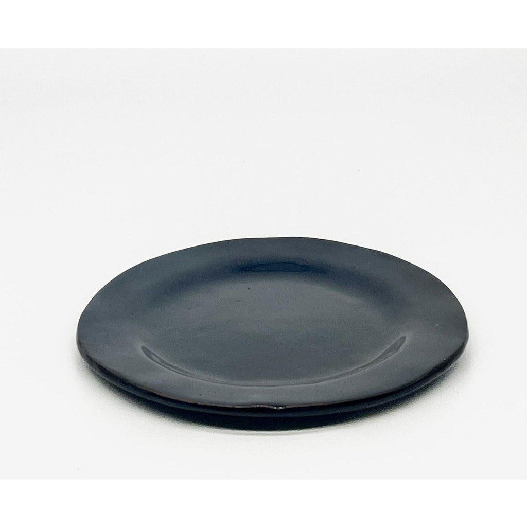 blue ceramic plate with a white background