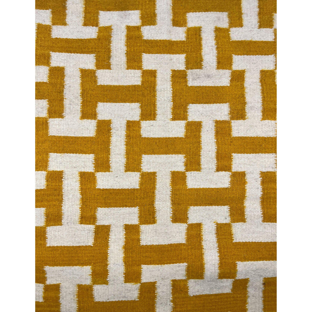 Studio CM | a yellow and cream  handmade rug from Oaxaca. It is made by Zapotec 10th generation artisans. The rug is 100% natural materials.