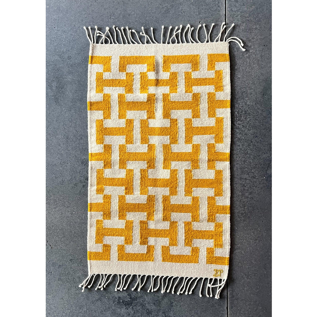 Studio CM | yellow and white design handmade run from Oaxaca. It is made by Zapotec 10th generation artisans. The rug is 100% natural materials. 