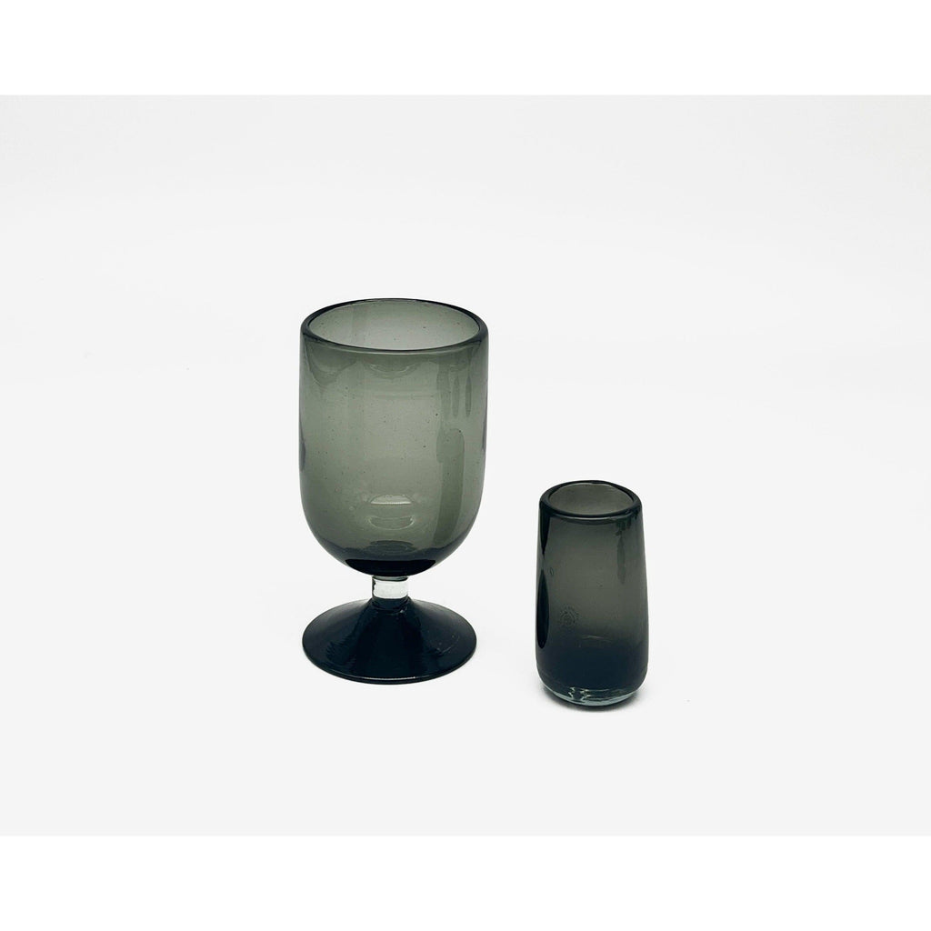 Studio CM | a single shot and a stemme glass made of handblown black recycled glass