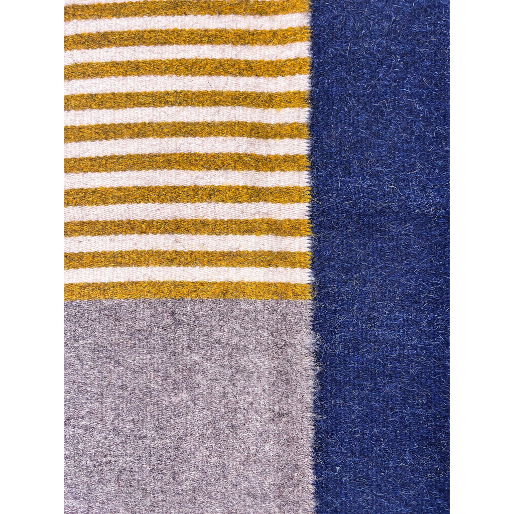 Studio CM | a modern stripped handmade rug from Oaxaca. It is made by Zapotec 10th generation artisans. The rug is 100% natural materials.